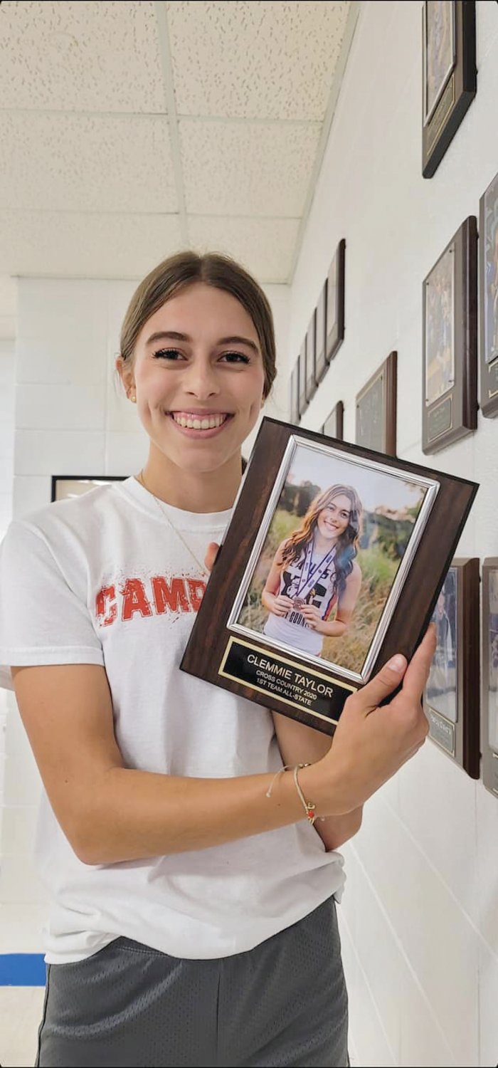 Hartville’s Clemmie Taylor after placing her plaque on her school’s All-State Honor Wall. She was an All-State in 2020 and 2021.